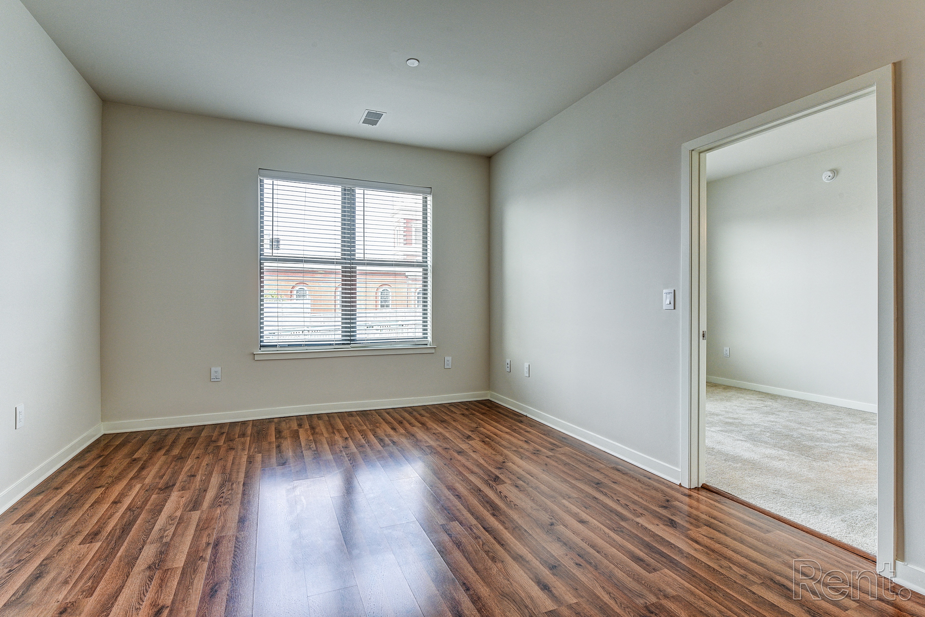 Bedroom with hardwood floors and a large window  at The View at Old City, Philadelphia