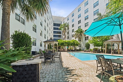 Pool surrounded with table and chairs at Esplanade at City Park, Louisiana, 70119