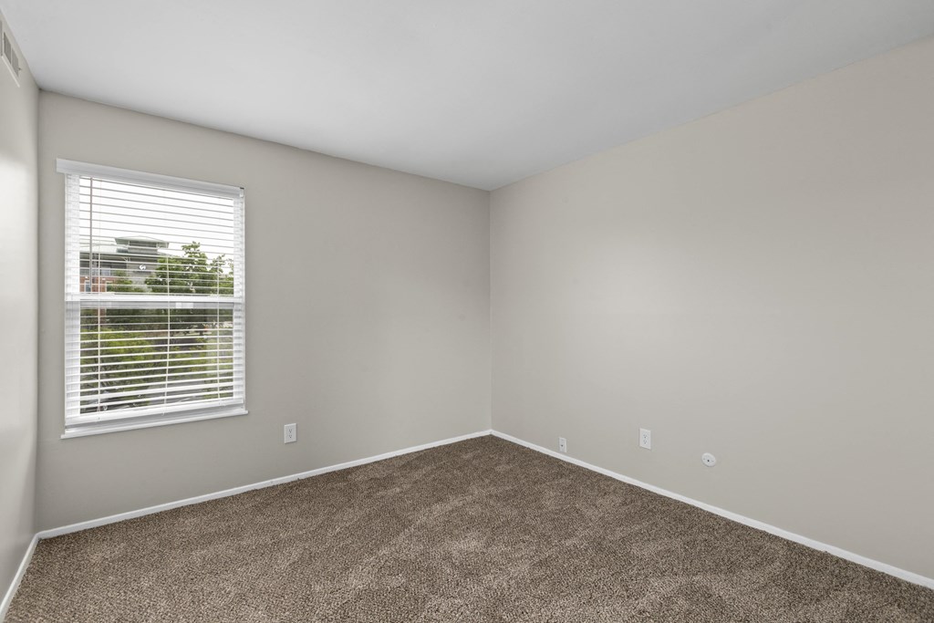 Bedroom with gray walls and a window with a blind at Creve Coeur, Creve Coeur, MO