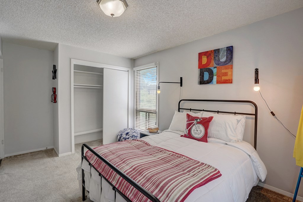Bedroom with a bed, window and closet at Governor's Park, Fort Collins, 80525