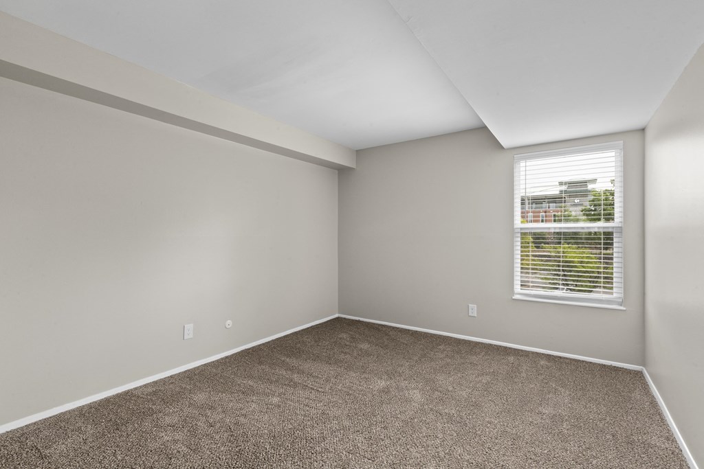Bedroom with gray walls and carpet at Creve Coeur, Creve Coeur, MO