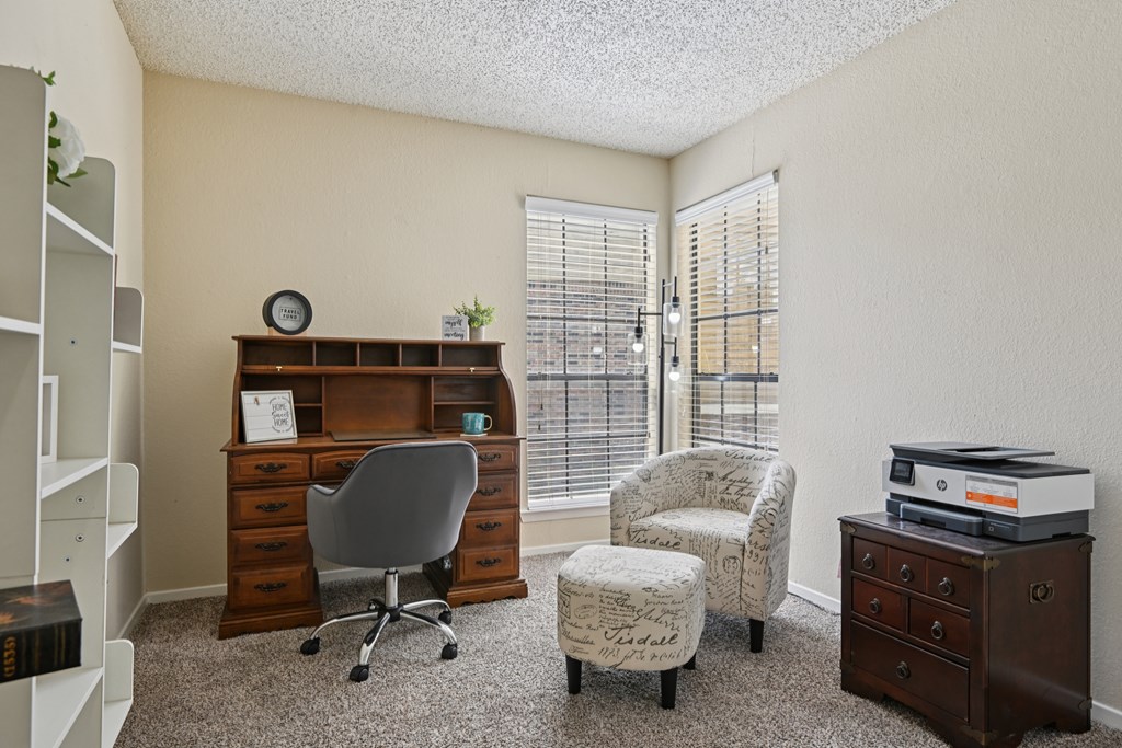 A room with a desk, chair, and printer. at The Glen, Texas, 75067