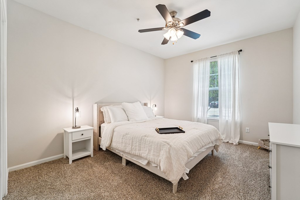 Bedroom With Ceiling Fan at Kingwood Glen, Texas, 77339