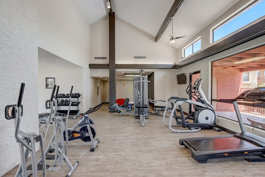 Gym with cardio equipment and weights at the Glen at Mesa Apartments, Mesa, Arizona 85201