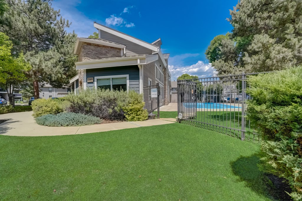 Leasing office with a pool in the backyard