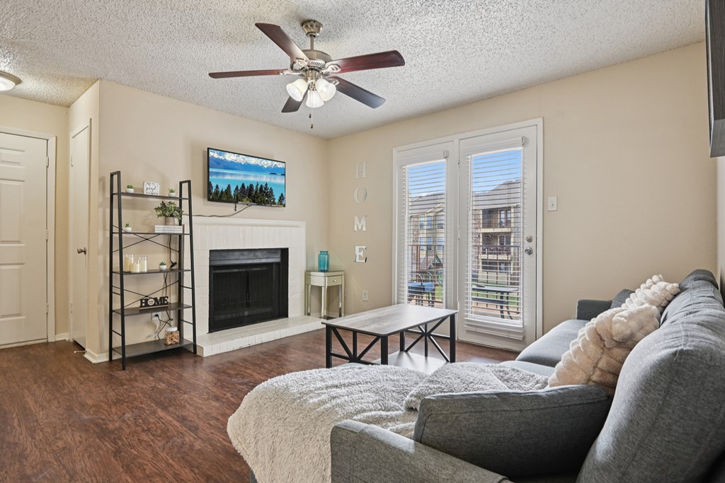 Living Room With Fireplace at The Glen, Lewisville, TX