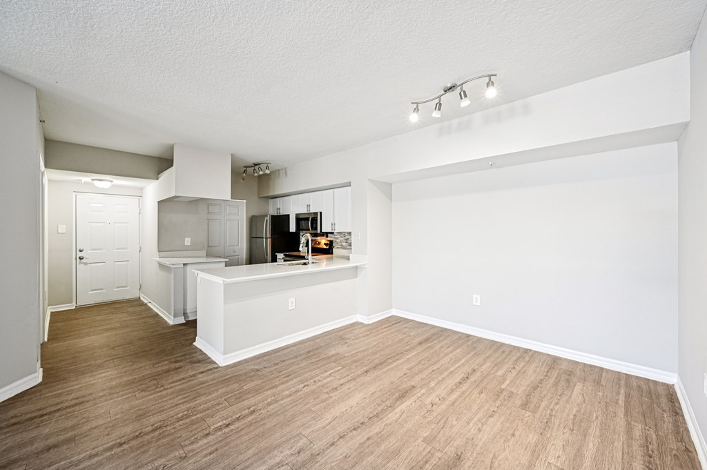 A kitchen area with a counter and a microwave. at Heritage Bay, Jensen Beach