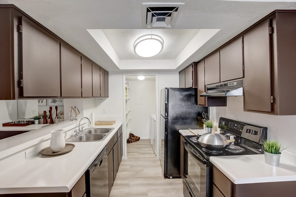 Kitchen with Dark Cabinets a kitchen with dark cabinets and white countertops at Glen at Mesa Apartments, AZ 85201