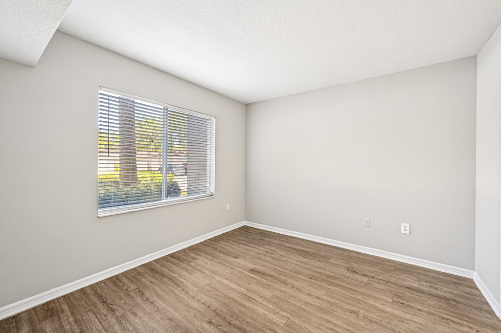 A room with a window and wooden flooring. at Heritage Bay, Florida