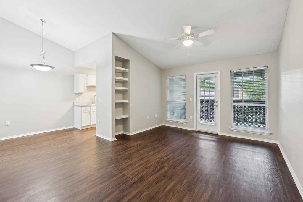 A room with a ceiling fan and a window with blinds at The Willows on Rosemeade, Dallas, TX 75287