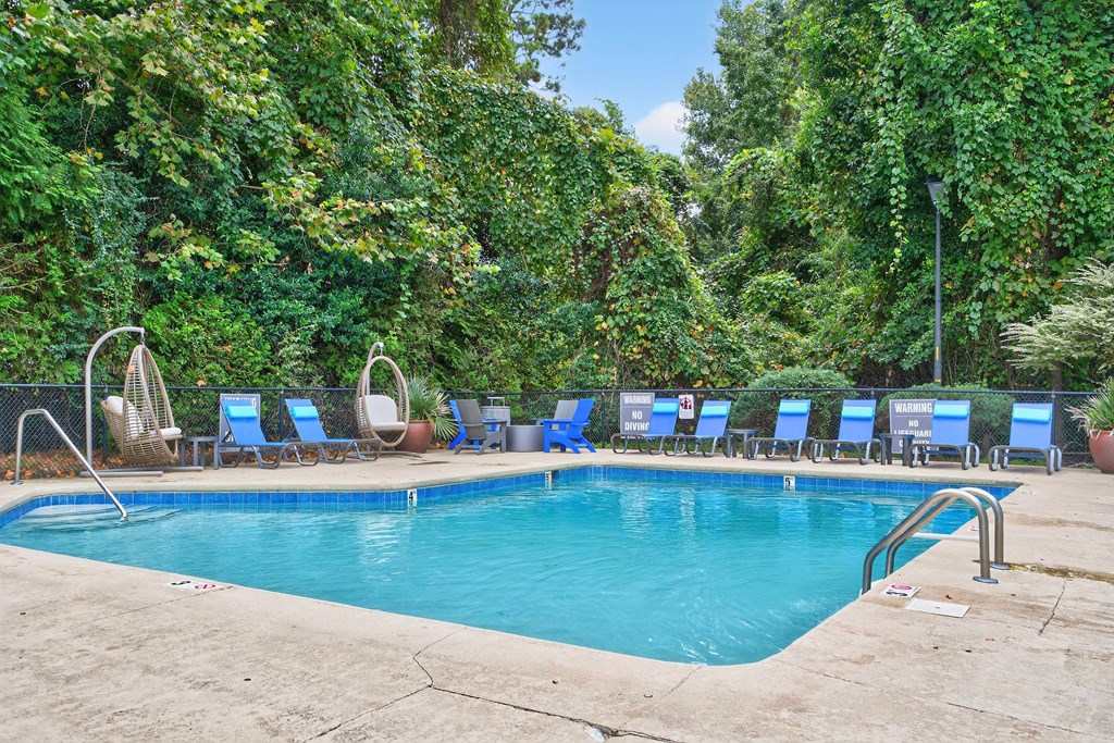 Pool With Relaxing Chairs at Lofts of Wilmington, North Carolina, 28405