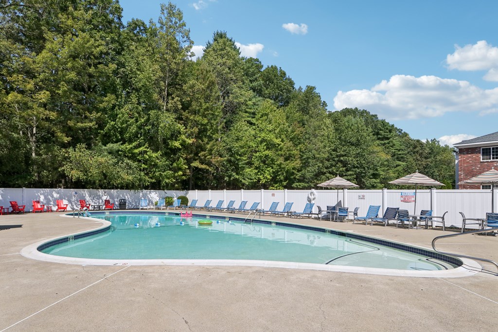 A large outdoor swimming pool  at Heritage at the River, Manchester, 03102