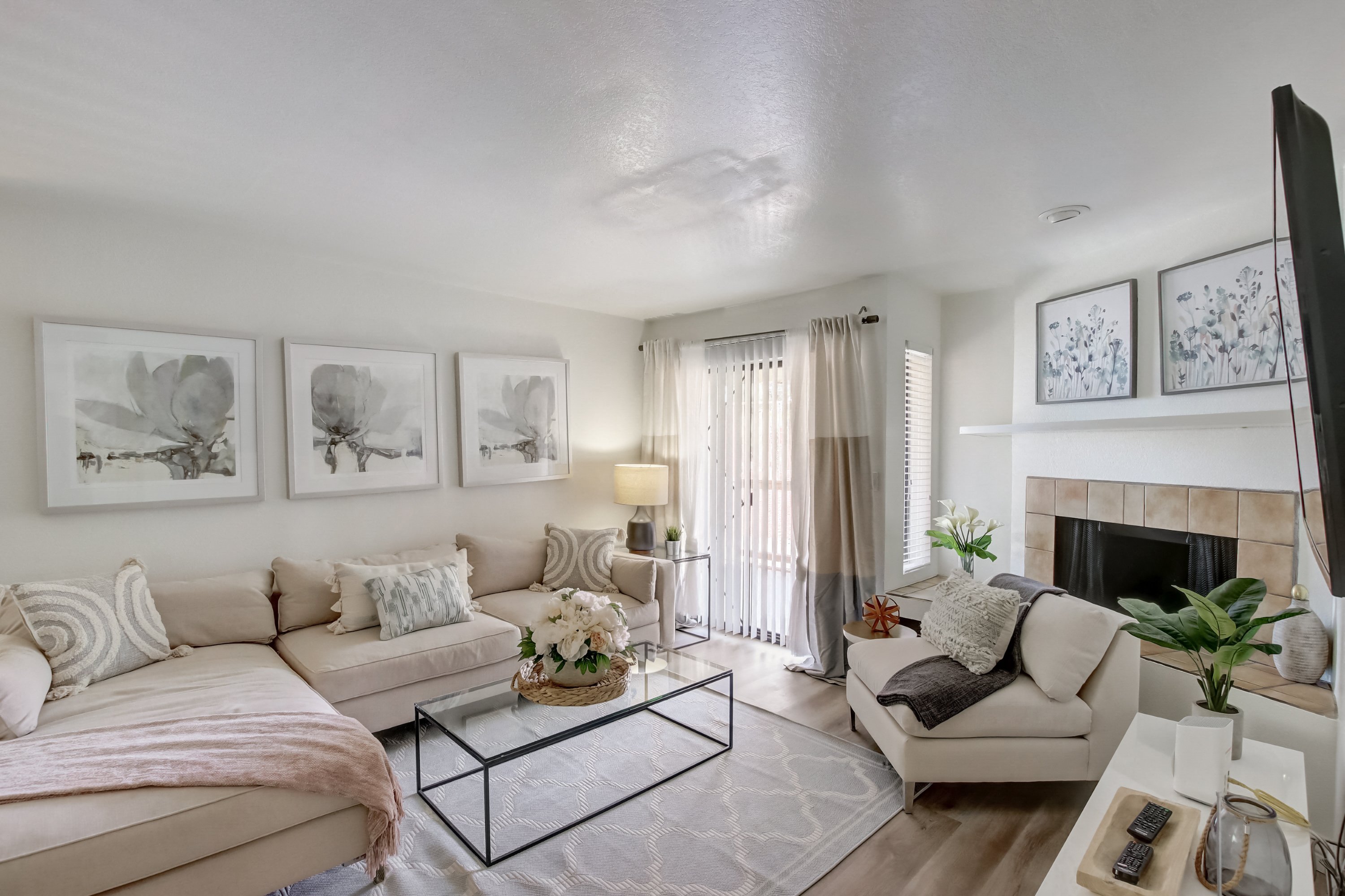 a living room with two couches a coffee table and a fireplace