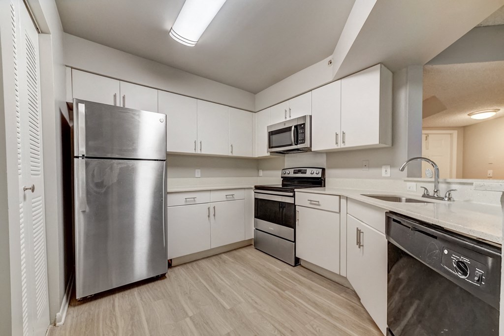 Kitchen with white cabinetry at Pembroke Pines Landings, Pembroke Pines, FL, 33025