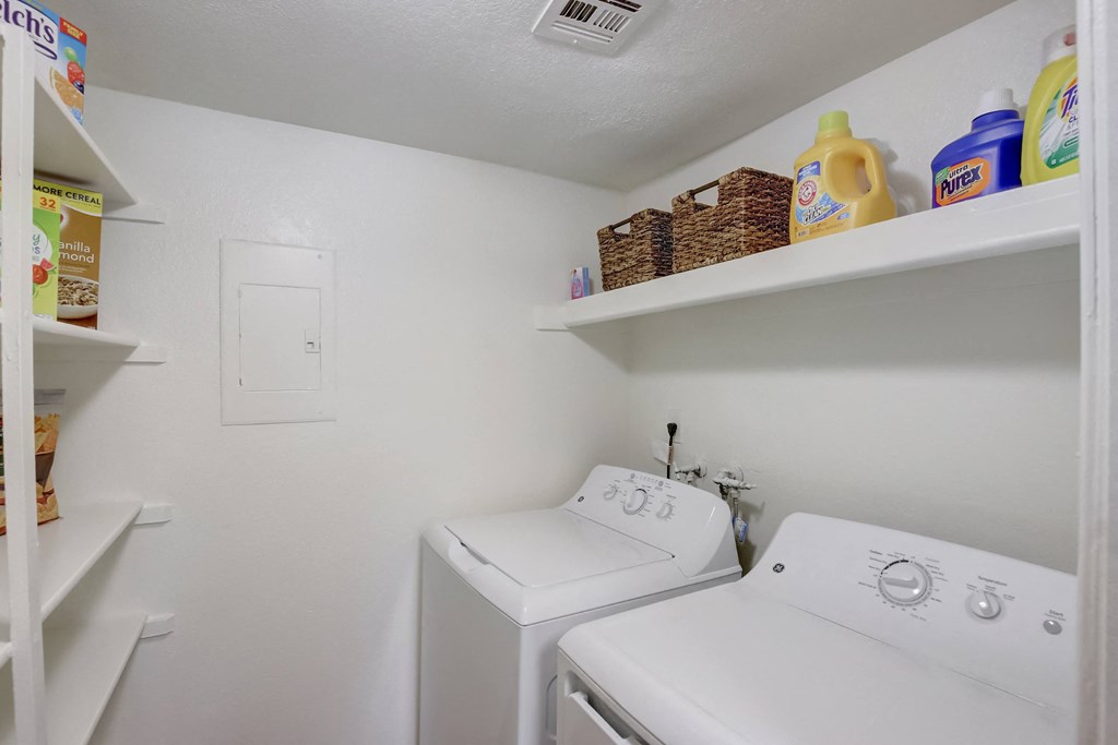 a laundry room with a washer and dryer at Glen at Mesa Apartments, Arizona 85201