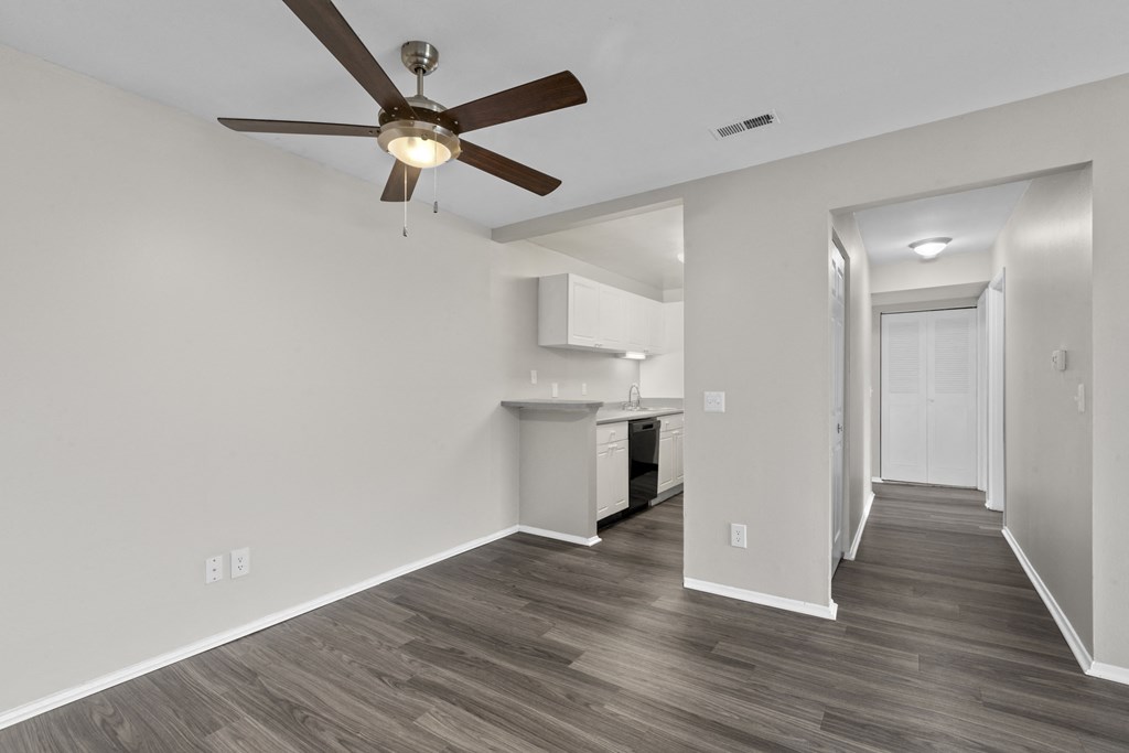 Bedroom with a ceiling fan and a kitchen in the background at Creve Coeur, Creve Coeur, MO