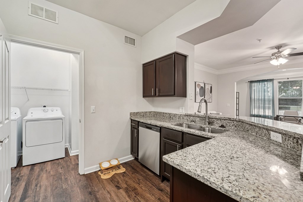 A kitchen with granite countertops and stainless steel appliances.at Kingwood Glen, Texas, 77339
