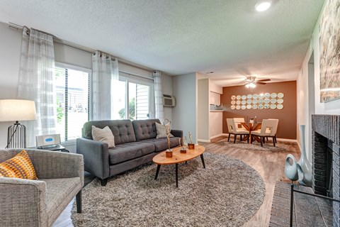 Liiving room with a couch and a table  at Union Heights Apartments, Colorado Springs, CO