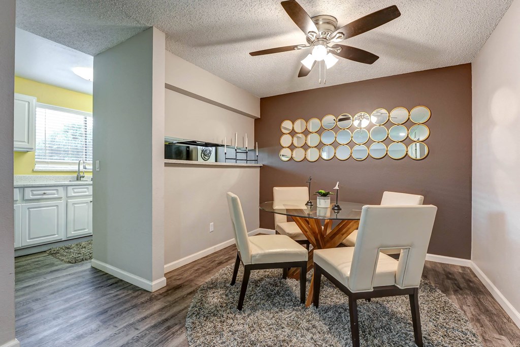Dining room with a table and chairs and a ceiling fan  at Union Heights Apartments, Colorado Springs, CO
