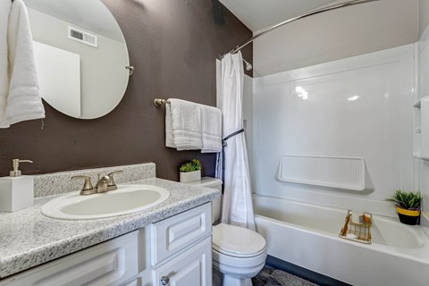 Bathroom with a sink toilet and bath tub  at Union Heights Apartments, Colorado Springs, CO