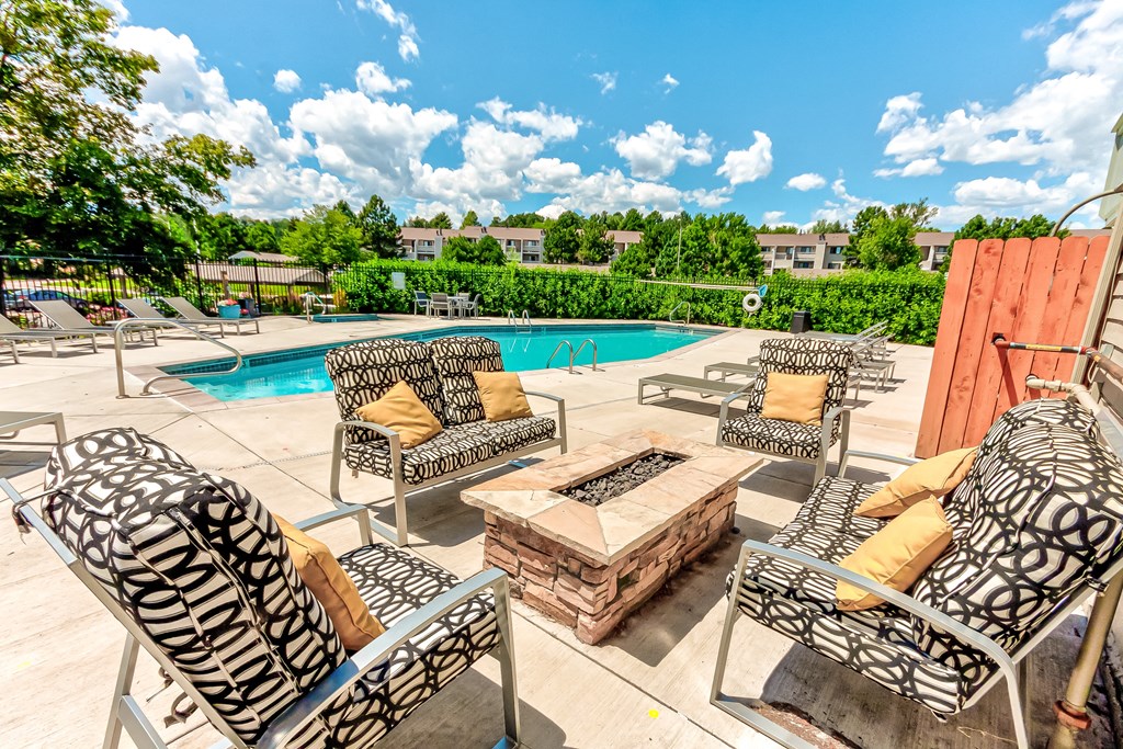 Pool area with chairs and a firepit  at Union Heights Apartments, Colorado Springs, CO