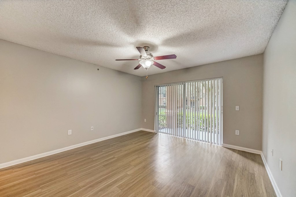 Living room with woodstyle floors and ceiling fan at Pembroke Pines Landings, Pembroke Pines, FL, 33025