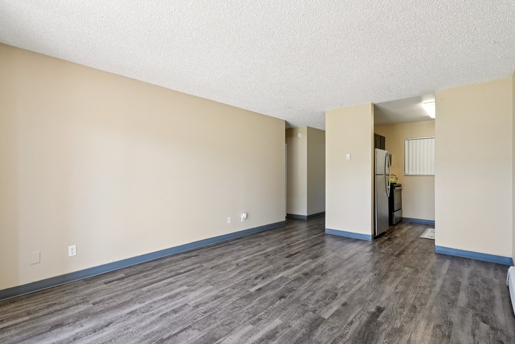 A room with wooden flooring and a doorway leading to another room. at Broadmoor Springs, Colorado Springs, Colorado