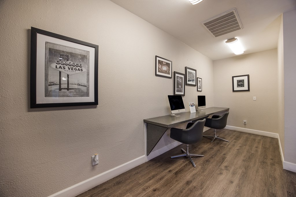 Computer center with a computer desk and a picture on the wall at 2900 Lux Apartment Homes, Nevada