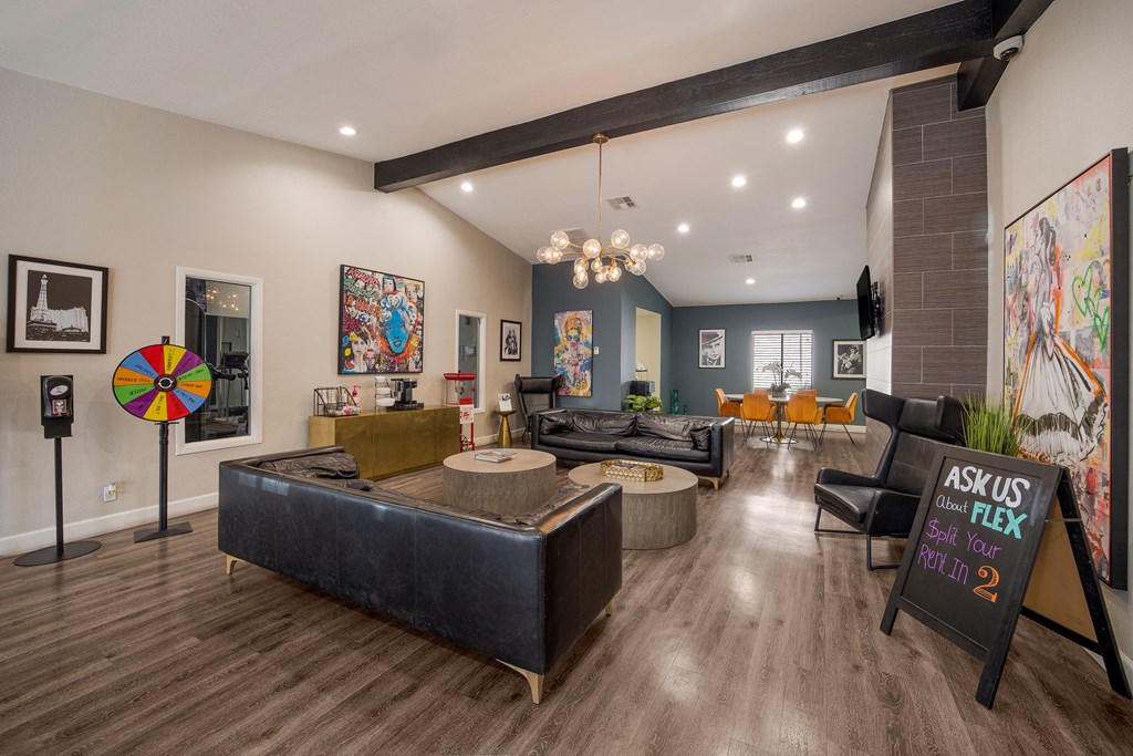 Clubhouse with couches and chairs and a table at 2900 Lux Apartment Homes, Nevada