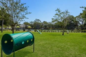 Dog park with agility equipment at Lakeside Glen Apartments, Melbourne