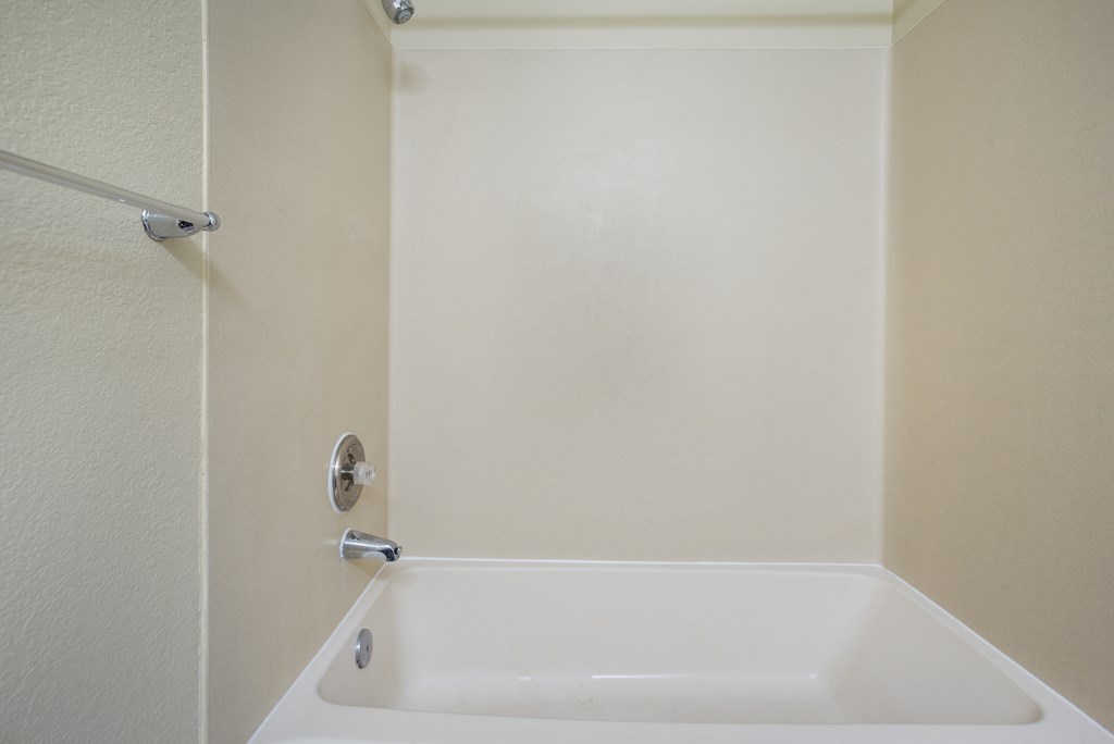 A bathroom with a bathtub and a shower at Arcadia Townhomes, Federal Way, WA