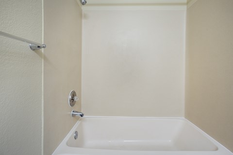 A bathroom with a bathtub and a shower at Arcadia Townhomes, Federal Way, WA