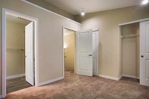 A bedroom with two doors at Arcadia Townhomes, Federal Way, WA