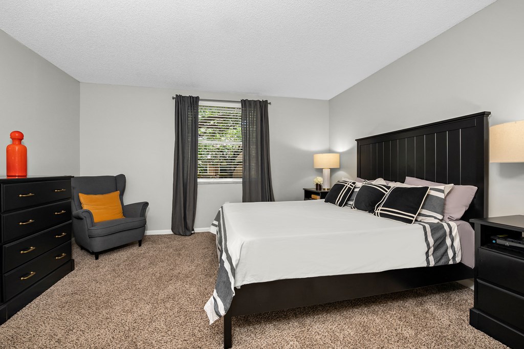an image of a bedroom with a bed and a chair at Pembroke Pines Landings, Pembroke Pines