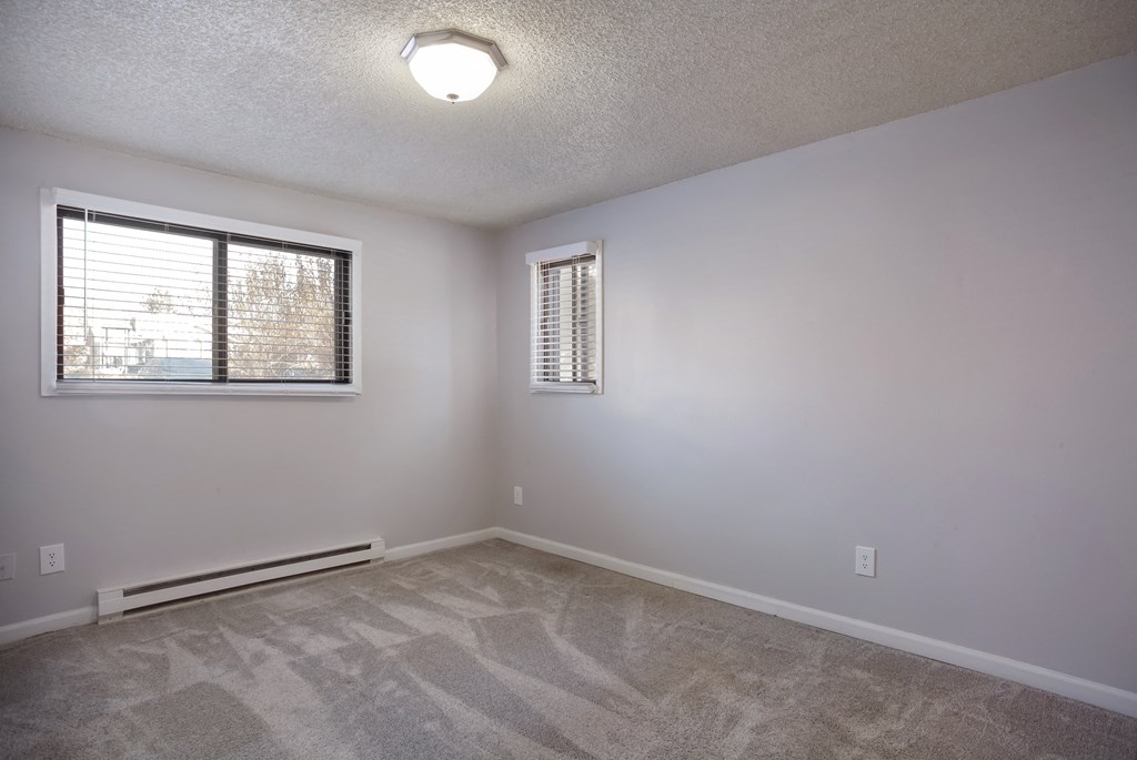 Living room of an empty house with a window  at Governor's Park, Fort Collins, 80525