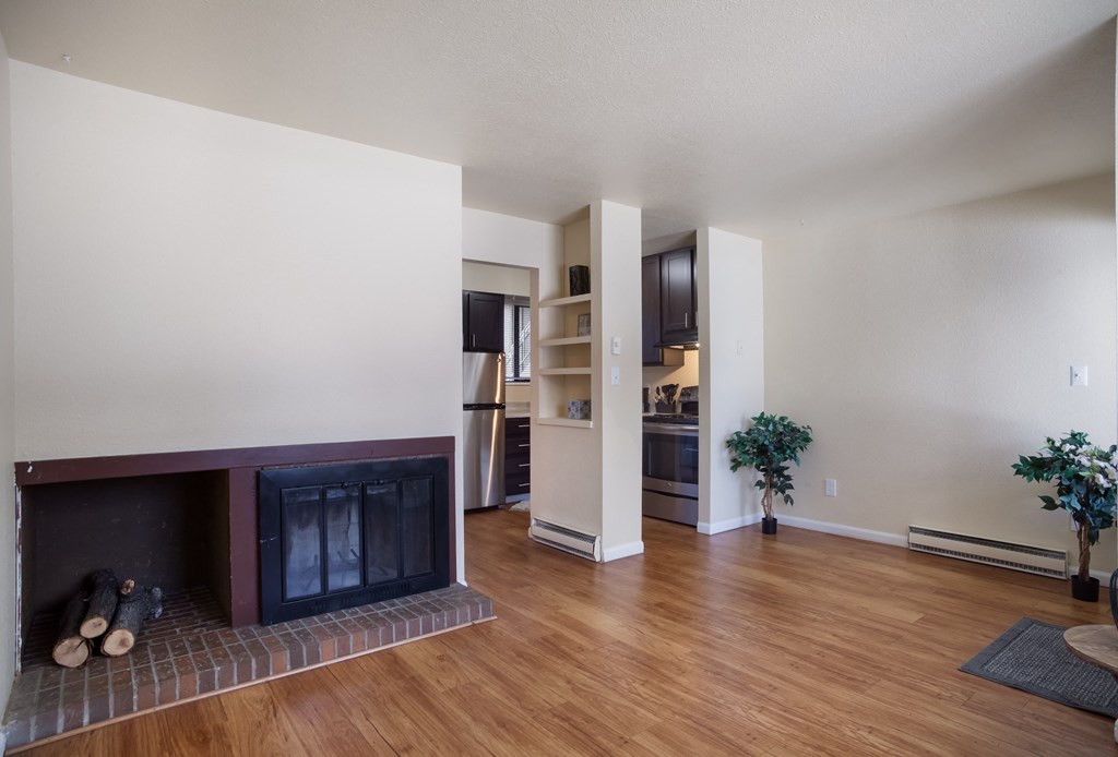 Empty living room with a fireplace   at Governor's Park, Fort Collins, 80525