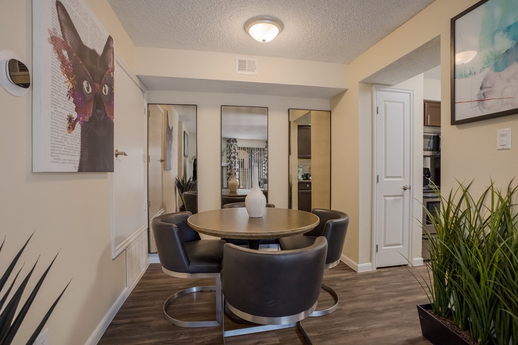 Dining room with a table and chairs at Mountain Run Apartments, New Mexico, 87111