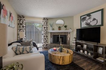 Living room with fireplace at Mountain Run Apartments, New Mexico, 87111