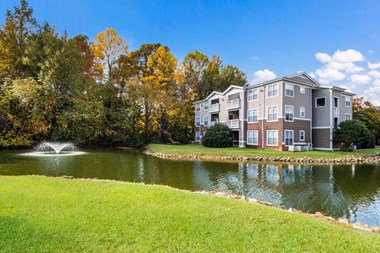 Lake With Lush Natural Surrounding at Cedar Springs Apartments, Raleigh, 27609 - Photo Gallery 2