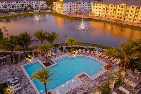 Sunset Drone View of Buildings, Pool, and Lake at Edge75, Naples, FL 34104