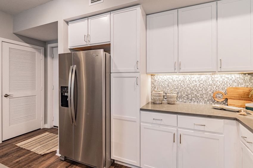 Double Door Refrigerator and White Cabinetry Double Door Refrigerator and White Cabinetry at Edge75, Naples, Florida 34104 - Photo Gallery