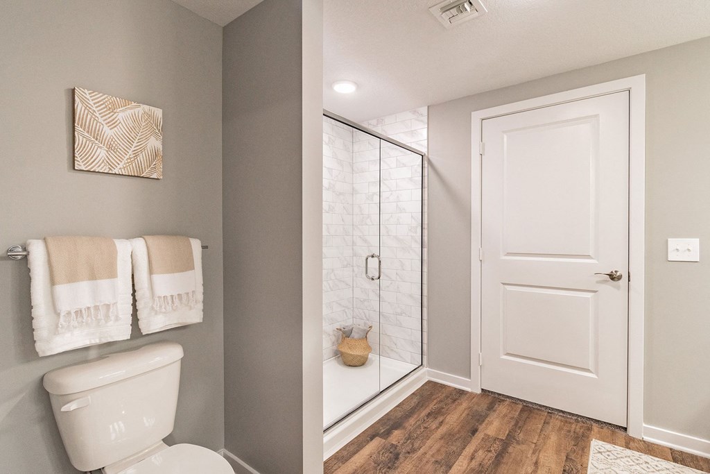Bathroom with Wood Style Flooring at Edge75, Naples, FL