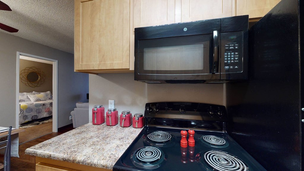 Kitchen with black appliances at Glen at Hidden Valley, Nevada