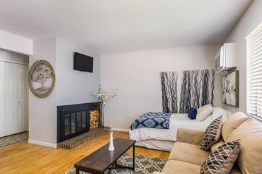 Living Room With Fireplace at Governor's Park, Fort Collins, CO, 80525 - Photo Gallery 3