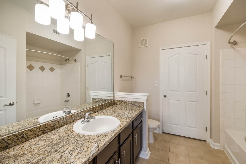 Bathroom With vanity Lights at Kingwood Glen, Texas, 77339