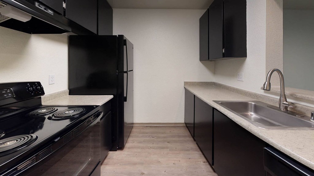 Kitchen with appliances at North Creek Apartments, Everett