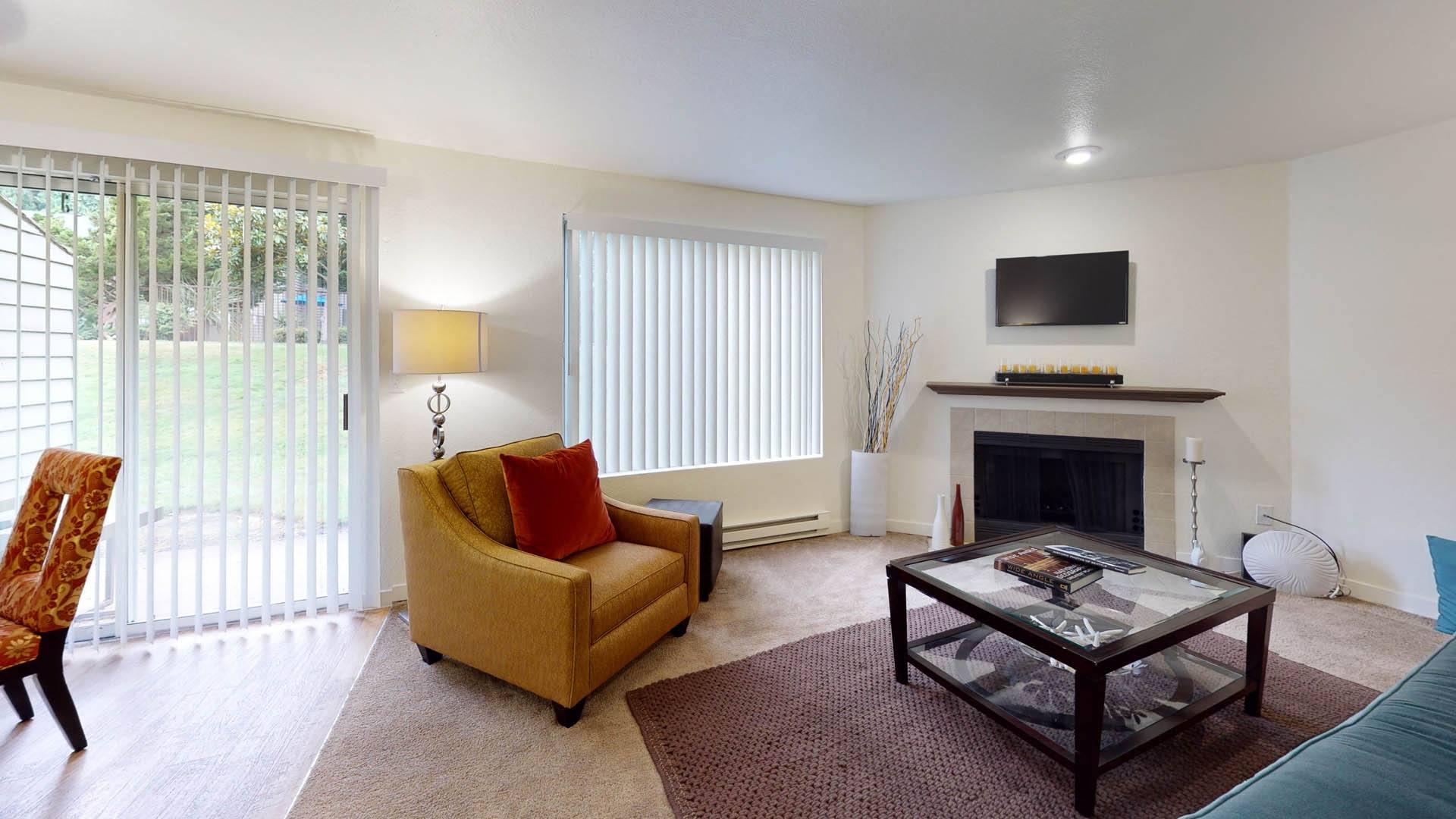 Living room with TV at North Creek Apartments, Everett