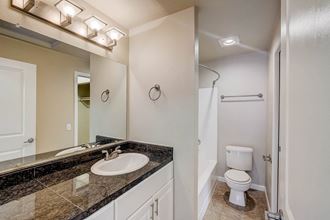 a bathroom with a sink and a toilet - Photo Gallery 4
