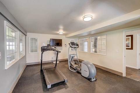 Gym at Glen at North Creek, Everett with a treadmill and a television
