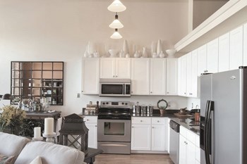 Kitchen with Stainless Steel Appliances at Riverwalk Apartments, Lawrence, MA - Photo Gallery 17